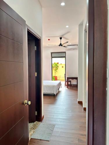 Cama o camas de una habitación en Richico Hoi An Villas