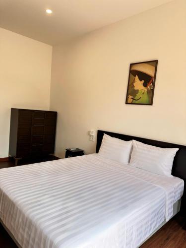 Cama o camas de una habitación en Richico Hoi An Villas