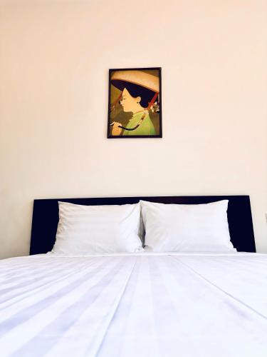 Cama o camas de una habitación en Richico Hoi An Villas