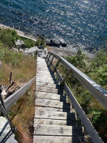 a set of stairs leading to the ocean at Fjordhus in Austerheim