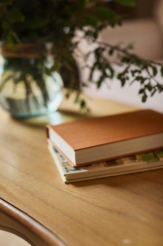two books sitting on top of a table at La Garriga de Castelladral in Castelladral