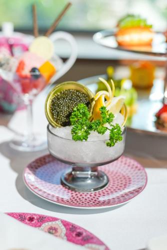 a bowl of food on a plate on a table at The St. Regis Lhasa Resort in Lhasa