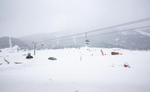 a ski lift with people on it in the snow at Balcons B 011 - PARC NAT VANOISE appart 6 pers in Val Cenis