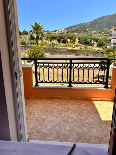 a room with a balcony with a view at Roe Sea View in Kyparissia