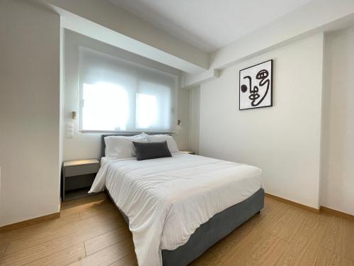 Ένα ή περισσότερα κρεβάτια σε δωμάτιο στο Athenean Cultural Retreat Stavros Niarchos