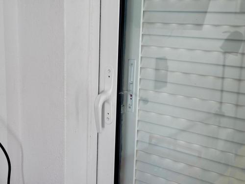 a close up of a door with a window at Athenian Sky in Athens