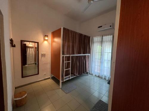 a room with a mirror and a shelf in it at PearlDrop Hills Kandy in Kandy