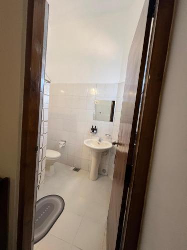a bathroom with a sink and a toilet at PearlDrop Hills Kandy in Kandy