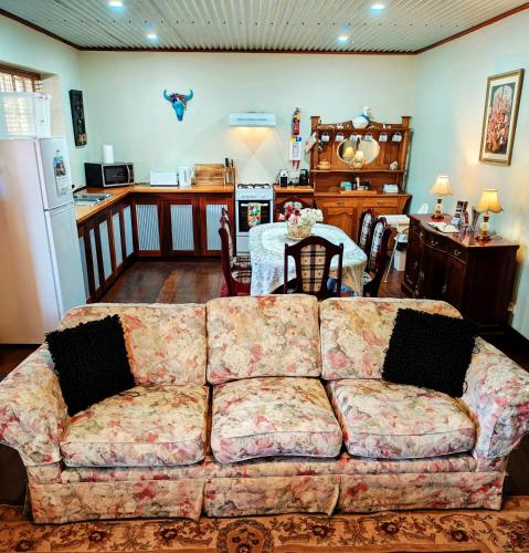 a living room with a couch and a kitchen at York Cottages and Burnley House in York