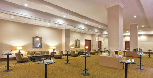 a lobby with couches and tables in a building at Akka Antedon Hotel - Premium Ultra All Inclusive in Beldibi