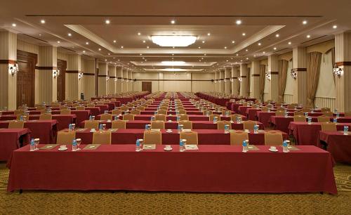 a large banquet hall with red tables and chairs at Akka Antedon Hotel - Premium Ultra All Inclusive in Beldibi