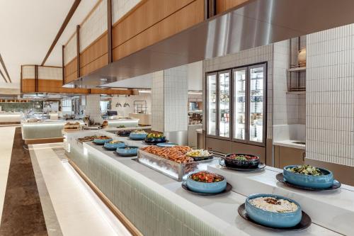 a buffet line with many different food dishes on it at Akka Antedon Hotel - Premium Ultra All Inclusive in Beldibi