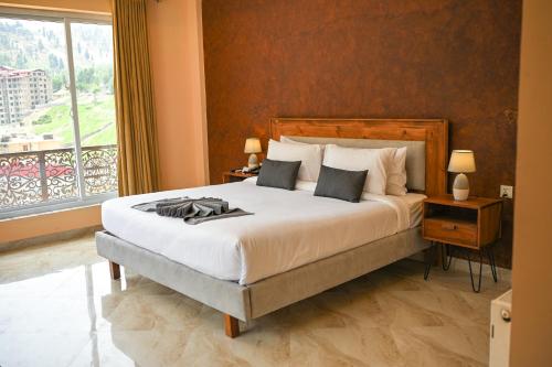 Postel nebo postele na pokoji v ubytování Hotel Demanchi By The Leaf