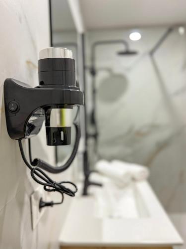 a camera on the wall of a bathroom at Boutique Palacio Centro in Alicante