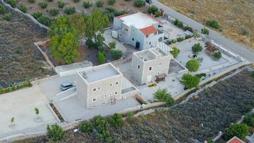 an overhead view of a large house with a driveway at Armenopetra View Gerolimenas in Gerolimenas