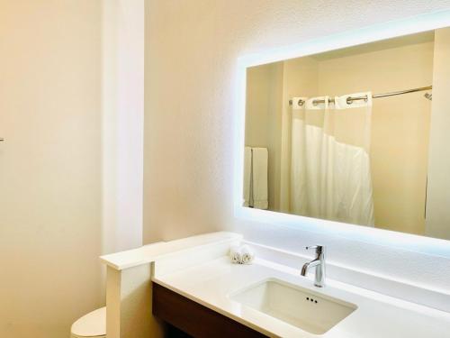 a bathroom with a sink and a mirror at Holiday Inn Express & Suites Blythe by IHG in Blythe