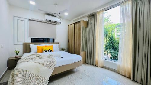 Ένα ή περισσότερα κρεβάτια σε δωμάτιο στο Olive Serviced Apartments - HICC Hyderabad