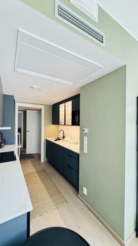 a kitchen with a sink and a counter top at BJØRVIKA Apartment-Privat Lounge with Beautiful View & Close to everything in Oslo