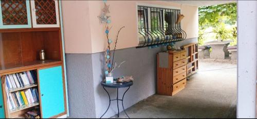 a living room with a table in a room with a staircase at Lotus Oasis I Nature Experience in Torre
