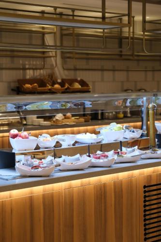 a bunch of dishes on a counter in a kitchen at Sia Hotel Thermal & Spa in Nilüfer