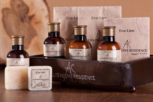 four bottles of wine in a wooden box at All Seasons Residence Design Hotel - Free parking in Sofia