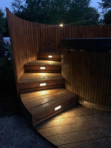 a set of stairs with lights on them at The Nutshell met hottub en sauna | 2 personen in Neede