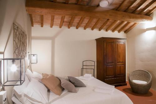 Postel nebo postele na pokoji v ubytování Palazzo Massaini - Cavarciano
