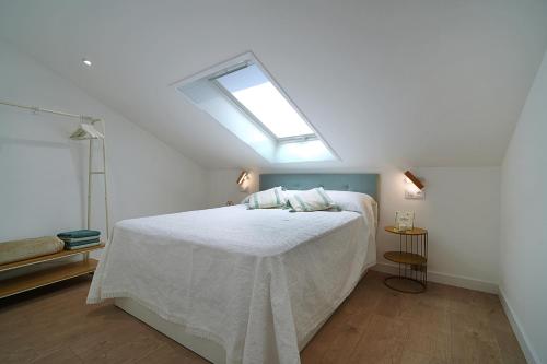 Postel nebo postele na pokoji v ubytování Ático en pleno centro de Portonovo, Sanxenxo