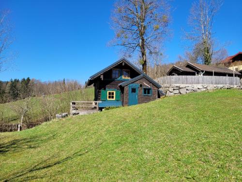 a house sitting on top of a grassy hill at Ferienhaus Kübl in Krispl