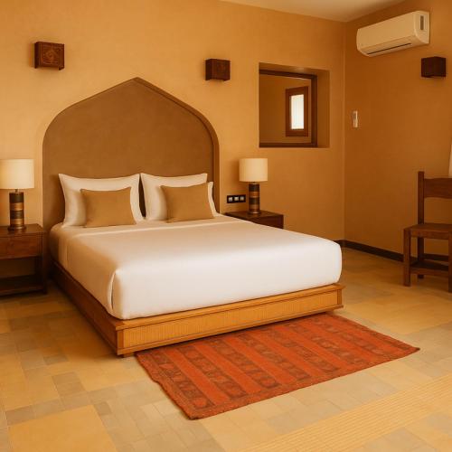 Una cama o camas en una habitación de Ksar Massa