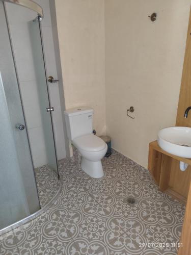 a bathroom with a toilet and a sink at 193 Urban Hotel in Patra