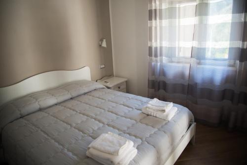 Letto o letti in una camera di Villa Caterina Affittacamere