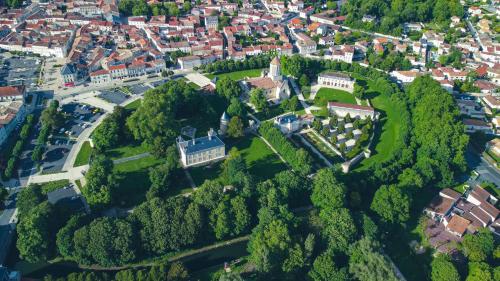 an aerial view of a mansion on a hill with trees at El Castillo Face au Château et Climatisé in Surgères
