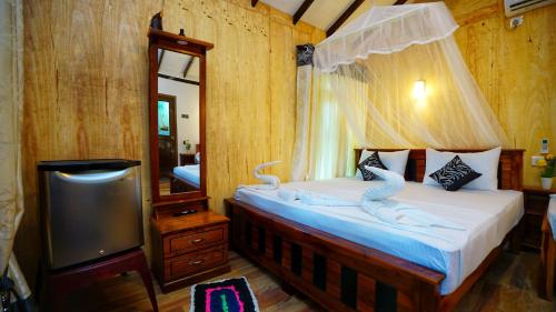 Cama o camas de una habitación en Akash Treehouse
