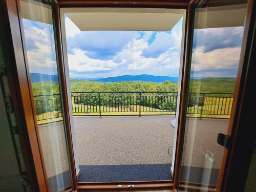 a view from a sliding glass door of a balcony at Dom Gościnny Sawinka in Polańczyk