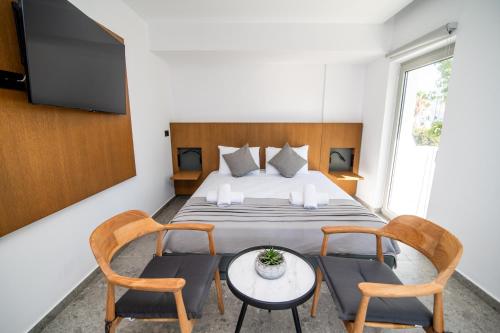 Postel nebo postele na pokoji v ubytování Jasmine Hotel Apartments