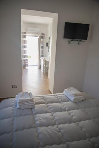Letto o letti in una camera di Villa Caterina Affittacamere