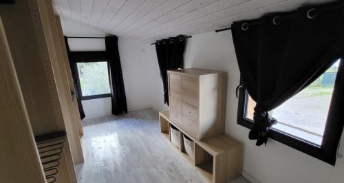 a small room with a dresser and a window at Belle maison avec piscine à 5 min de la cathédrale de Bazas in Bazas