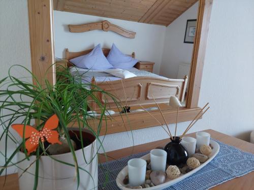 a bedroom with a bed and a table with a mirror at Weingut Stoff in Kitzeck im Sausal