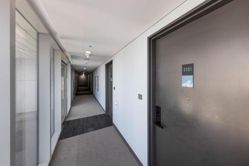 a corridor of an office building with a hallway at Marysol by Haeundae beach in Busan