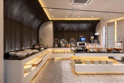 a kitchen with a counter with food on it at Marysol by Haeundae beach in Busan