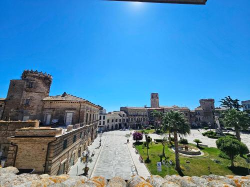 a large building with a courtyard in front of it at Domus Rossetti in Vasto