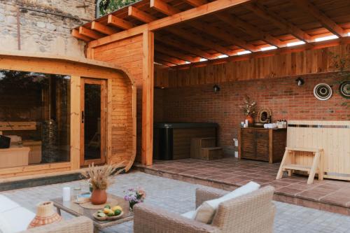 an outdoor patio with a table and chairs at Hameau Mukhrani in Mukhrani