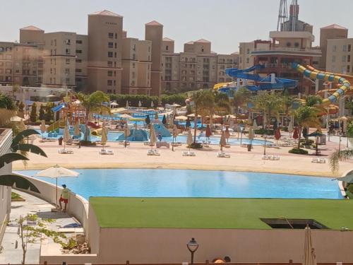 a pool at a water park in a city at Aqua view North coast-الكيلو 91- in El Alamein