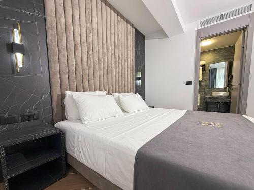 Ein Bett oder Betten in einem Zimmer der Unterkunft ES Hotel