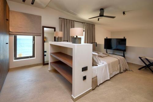 Cama o camas de una habitación en AÁSHNA Suites and Residences