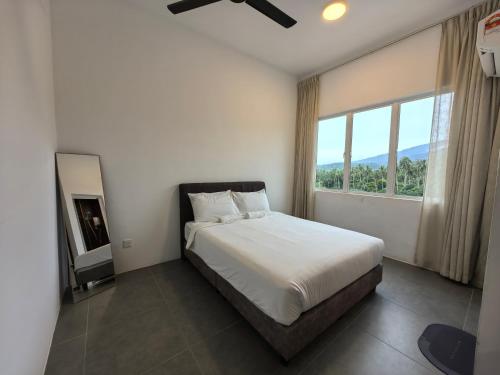 Ένα ή περισσότερα κρεβάτια σε δωμάτιο στο Simfoni Comfy Premium 13