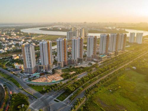 an aerial view of a city with tall buildings at DingD0ng Suites - The Sun Avenue - Free Pool & Gym in Ho Chi Minh City