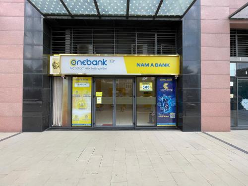 a store front of a building with doors open at DingD0ng Suites - The Sun Avenue - Free Pool & Gym in Ho Chi Minh City