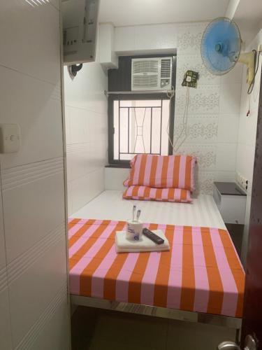 Postel nebo postele na pokoji v ubytování Manila Guest House